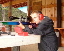 Adam shooting one of Dan's 6 PPC benchrest rifles after a match at the Helena Montana Prickly Pear Range, probably in the summer of 1999.