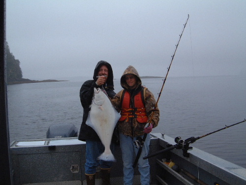 Alan and Sally with her first halibut from Alaskan waters. We caught our limit with fish from this size on up to about 40 pounds. It rained about 5” while we were there.