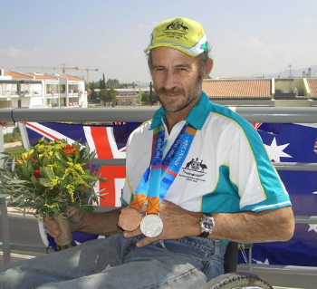 Ashley Adams of Austrailia with his Silver Medal from the 2004 Paralympics in Athens.