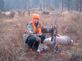 Carson with his first deer, a whitetail buck, at age 12. The rifle is a Lilja #1 contour 7mm/08 built on a Nesika T action with a Night Force 2.5-10 scope with the FC2 reticle. The stock is a McMillan by Truman Wilson.