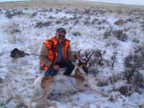 Dan with his antelope buck he snuck up on while it was in its bed. We don't hunt antelope in the snow under normal circumstances. It was quiet enough that I got to within 100 yards of this fellow while he looked the other direction. He was all by himself - no does to guard his backside.