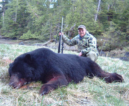 Dan's big black bear shot on Prince of Wales Island, Alaska. This guy has a 7' - 8" hide and an official skull score of 21 - 0/16" making him an all-time record book Boone & Crockett black bear. The rifle is a Lilja barreled 340 Weatherby on a Remington 700 stainless steel action, McMillan stock and Night Force 2.5 x 10 NXS scope.