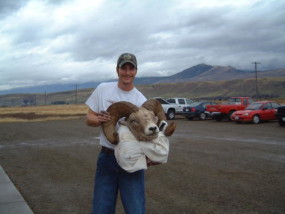 Jason with his very nice 8-year old bighorn ram shot about 10 miles from town. Jason used his 270 WSM Lilja barreled rifle to take this trophy in October of 2005.