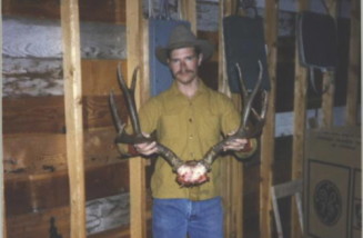 A Montana mule deer Dan shot in 1985 with a .300 Winchester Magnum and the 180 grain Nosler. Not a very good picture but a very nice heavy-horned 4-point buck.