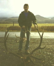ob Horton with a dandy 6-point bull and an unusual whitetail buck. Both shot in 1996.