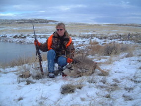 Sally with a nice 4-point mule deer she shot at 250 yards with her trusty 7mm/08. 