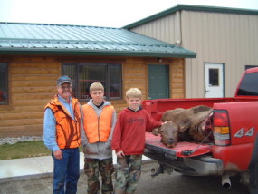 Dan, Carson and Travis with Travis' first elk, a nice big cow. We got her out in halves and loaded into the truck before noon.